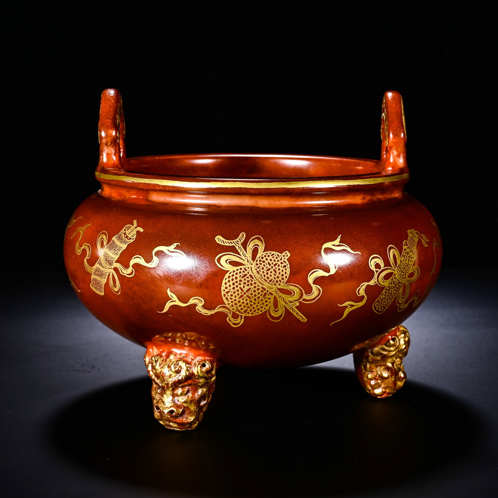 Qing Dynasty, Double-Eared Three-Legged Furnace with Gilded Patterns of the Eight Immortals in the: The ding-style censer has flared rim, contracted neck and rounded bulbous belly, fitted with a pair of upright handles and three gilded beast-mask feet, modeled after ancient bronze incense burner. It