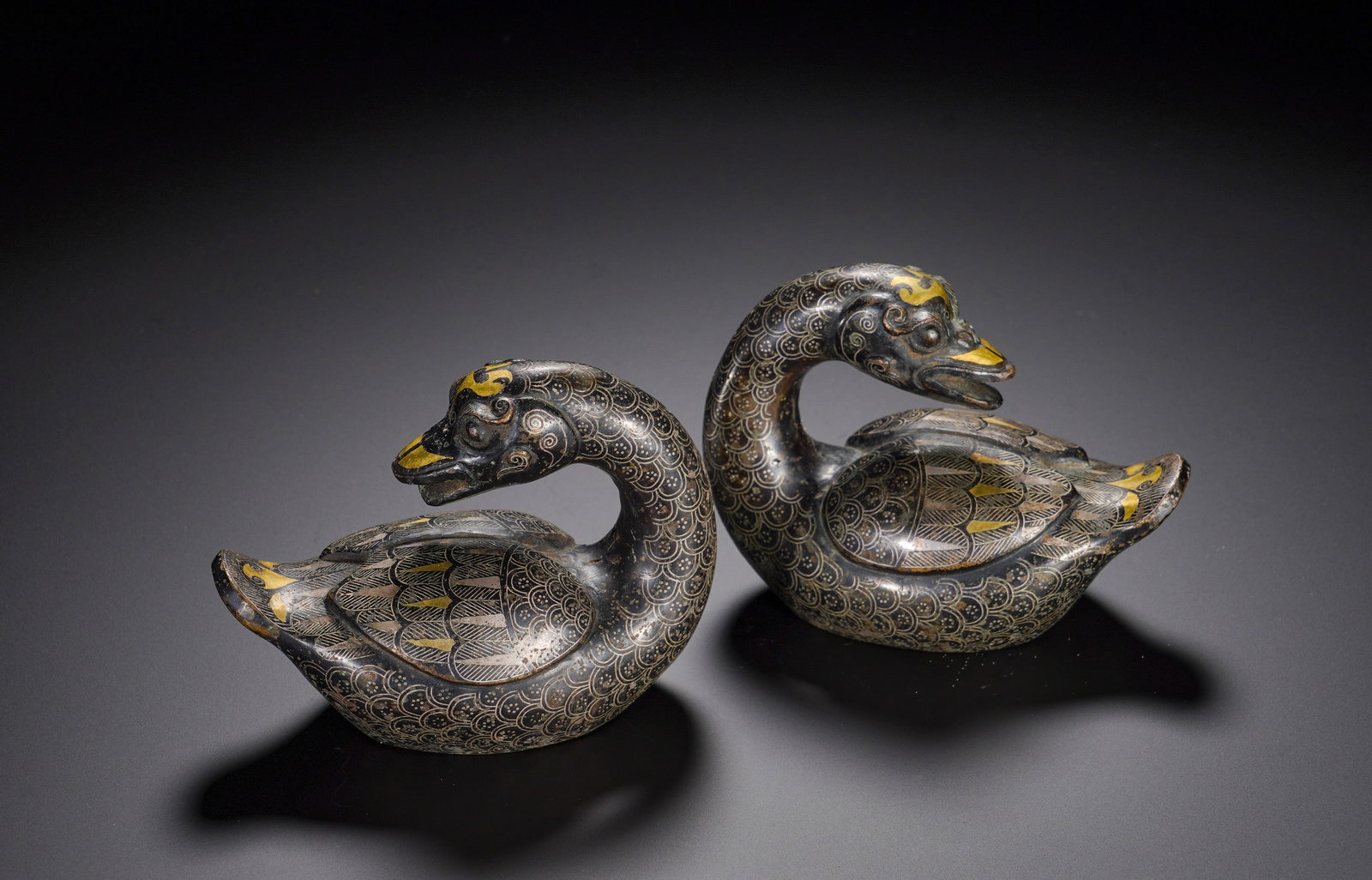 Warring States Period, Inlaid Gold and Silver Bronze Mandarin-Duck Mat-Weight Pair: The ducks feature curved necks and rounded plump bodies, symbolizing harmonious marriage and perfect companionship in ancient Chinese culture. They functioned as mat or paper weights for noble scholar