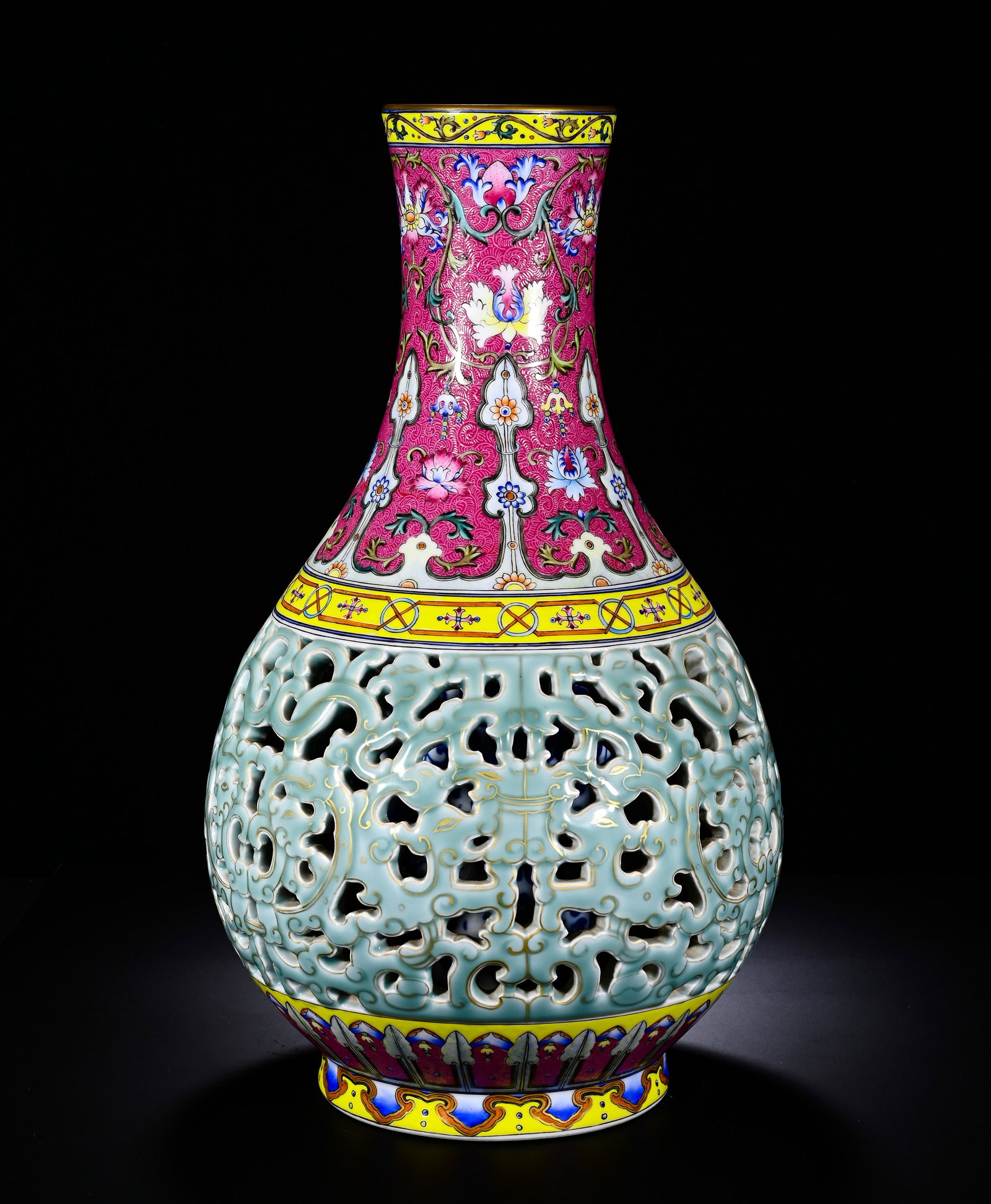 Qing Dynasty, Qianlong Period, Western-Style Polychrome Perforated and Entwined Kui-Dragon Pattern: This imperial double-wall vase is modeled in yuhuchun form with flared mouth, long neck, swelling body and ring foot. The neck is decorated with foreign enamel floral scrolls on ruby-red ground with g