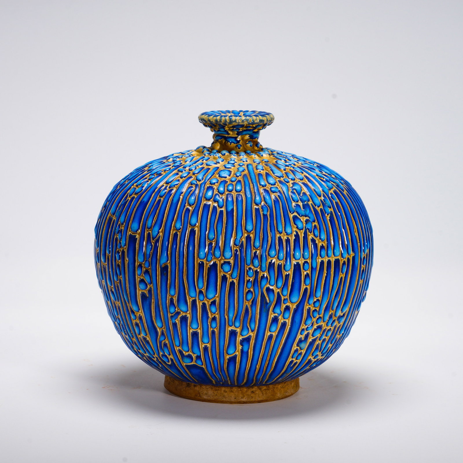 Qing Dynasty, Peacock Blue Glazed Pile Sculpture Flow-Patterned Pomegranate Vase: Globular-bodied vase with short neck and small flared mouth, rounded full belly, short ring foot. The surface adopts raised relief pile-glaze craft, presenting vertical streaming-vein texture, deep tu
