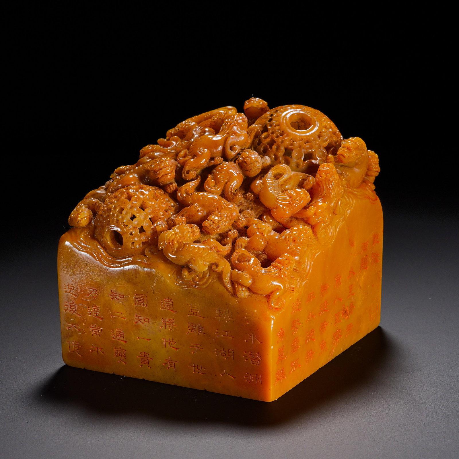 Qing Dynasty, Shoushan Tian Huangqun Chi Hollowed-Out Rotating Ball Knob "Qianlong Imperial View: A large-sized imperial-style square seal of Qing dynasty in Shoushan Tianhuang stone. The stone is oily and waxy with warm honey-yellow tone and profound aged patina. The knob combines high-relief car