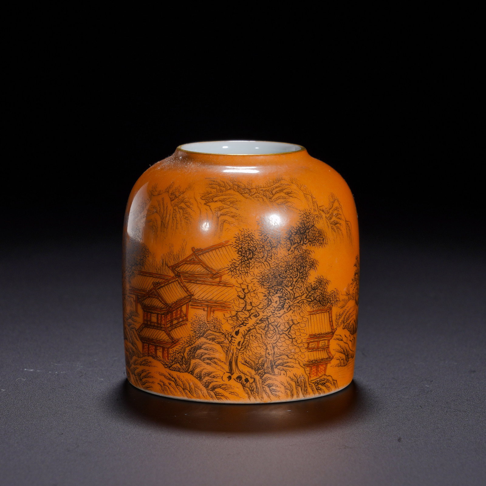 Qing Dynasty, Yongzheng Period, Water Bowl with Ink-Colored Landscape and Pavilion Patterns on a Red: An imperial scholar-studio water pot of the Yongzheng reign. It takes the classic horseshoe form with a small mouth, hoof-shaped body, recessed base and gilded rim - a compact, well-proportioned vesse