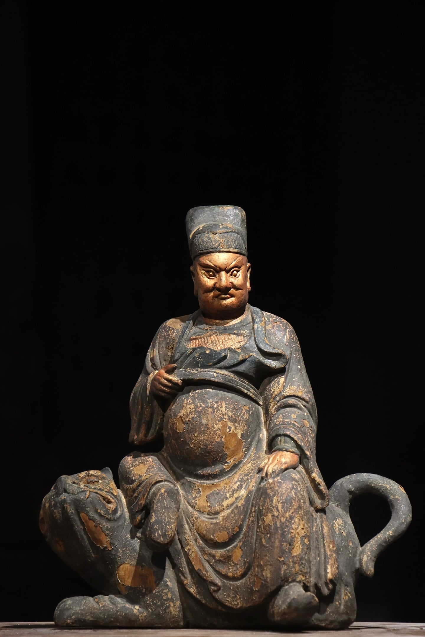 Ming Dynasty, Nanmu God of Wealth Zhao Gongming: A Ming-Qing Dynasty wooden lacquered and gilded painted statue of Zhao Gongming (God of Wealth). Carved from solid wood, it is decorated with lacquer, gilding and mineral pigments. The statue is depic