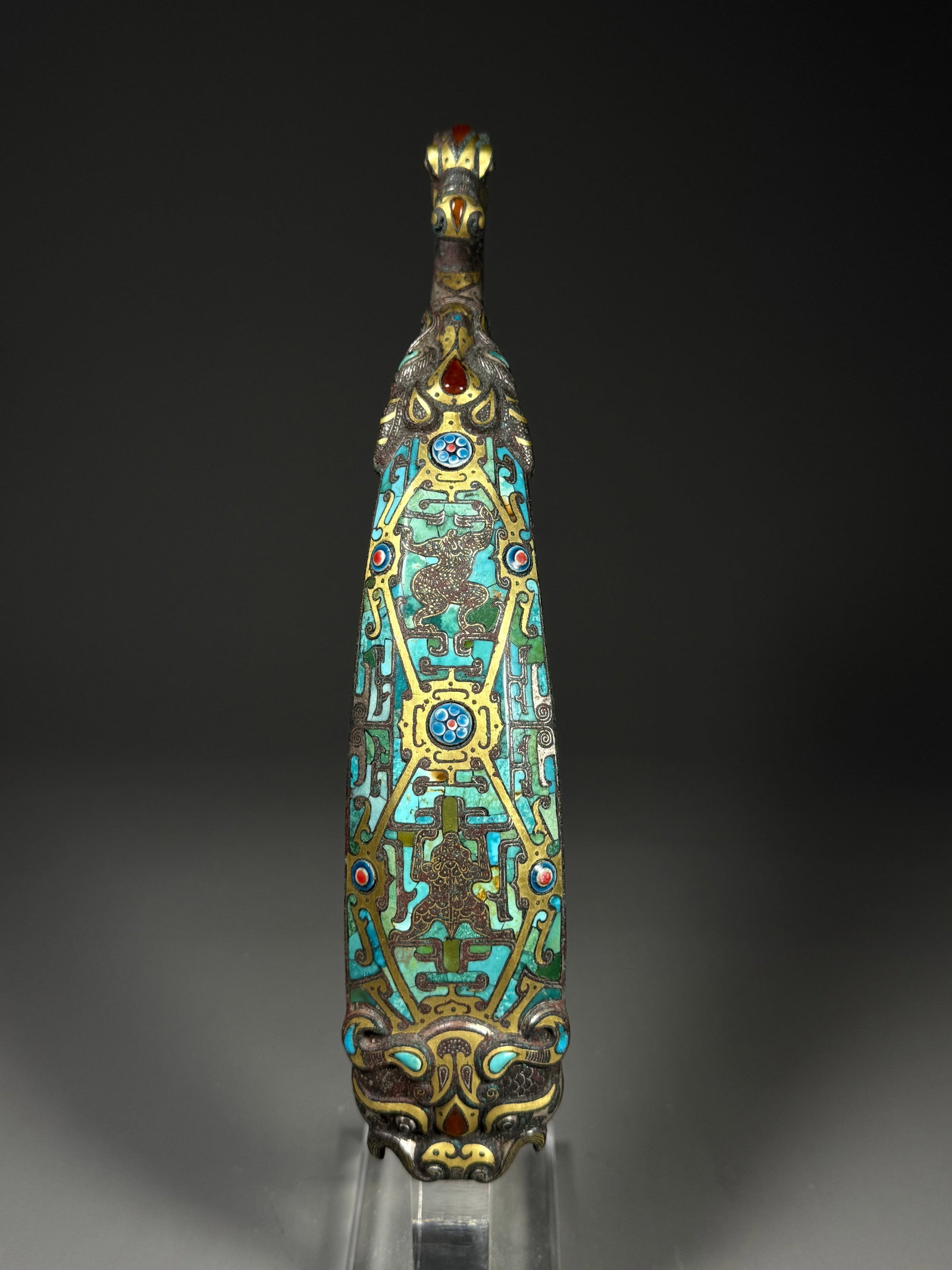 Warring States Period, Bronze Belt Hook with Inlaid Gold and Silver Inlaid Glazed Auspicious Beast: Warring States Bronze Belt Hook with Gold-Silver Inlay, Turquoise & Glass Inlaid Auspicious Beast MotifsCast in bronze, this waist hook is outlined with interwoven gold and silver wire. Its head is sh