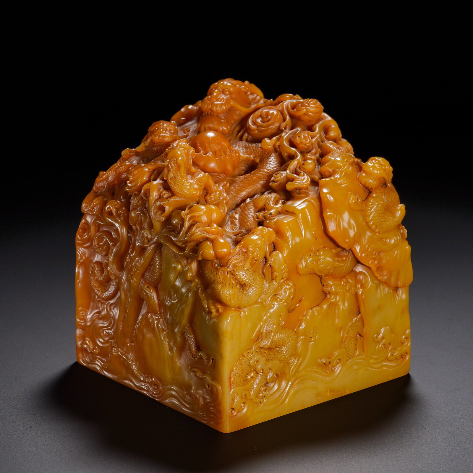 Qing Dynasty, Shou Shan Tian Huang Qun Long Landscape Play Pearl Knob "Qianlong Imperial View: A monumental imperial square seal of Qing dynasty carved from Shoushan Tianhuang stone. The stone is compact and waxy with rich golden-yellow tone and deep antique patina. The knob is executed in pano