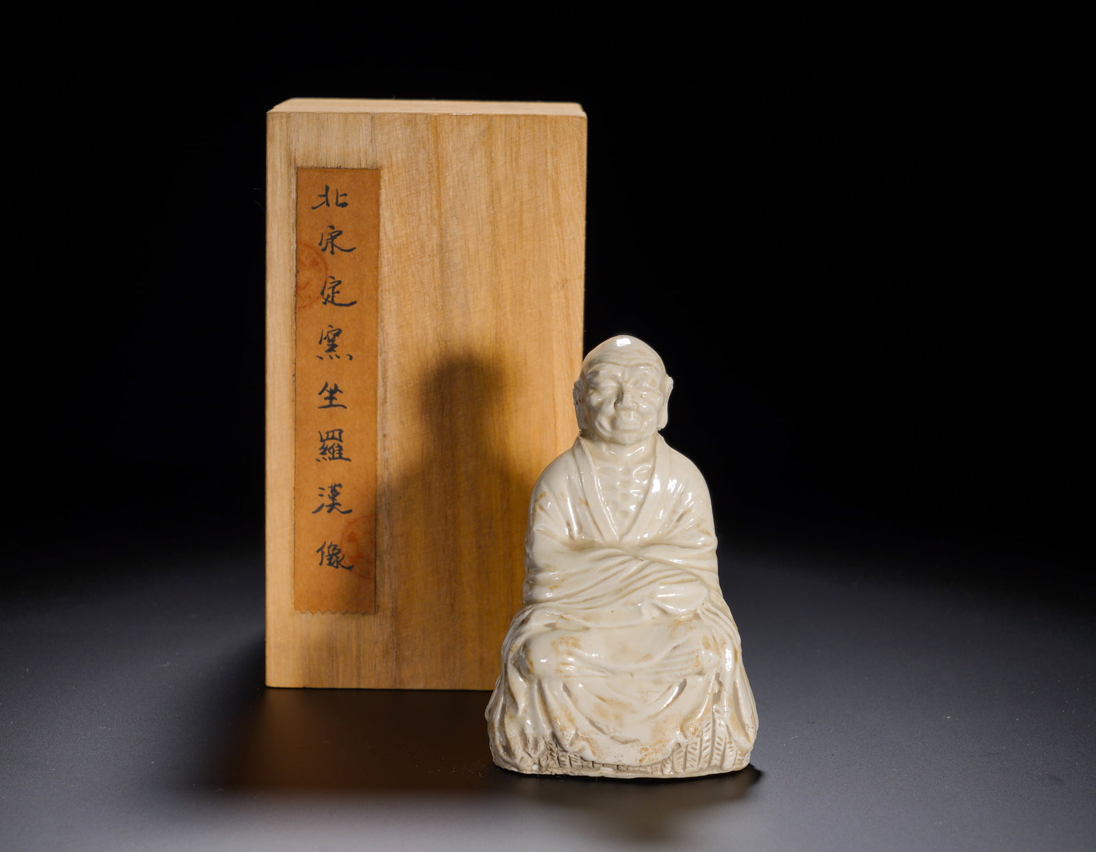 Northern Song Dynasty, White Glazed Seated Luohan Figure from the Ding Kiln (1 of 11)