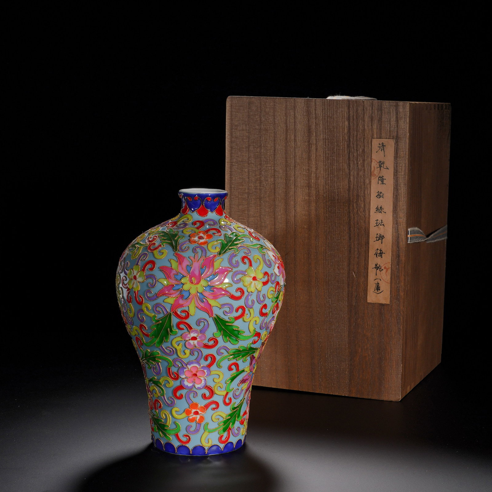 Qing Dynasty, Qianlong Cloisonne Enamel Plum Vase with a Pattern of Coiled Branches and Precious: A Qian-long-era cloisonne meiping vase. It has small compressed mouth, narrow neck, full broad shoulder, tapering lower body and recessed foot, representing classic meiping silhouette. The light-blue 