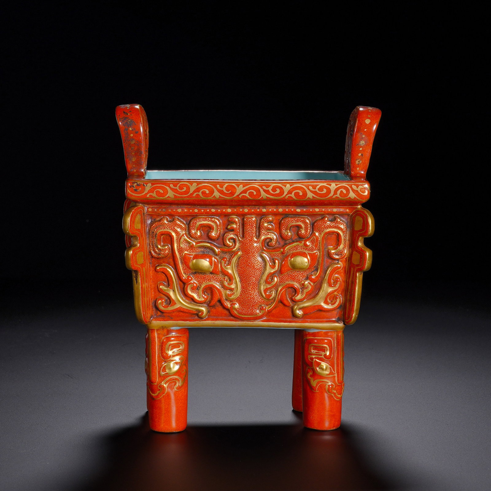 Qing Dynasty, Qianlong Period, Gilded and Carved Animal Face Patterned Tripod Furnace: An imperial archaistic ritual vessel of Qianlong reign, modeled after Shang-Zhou bronze ding. Square mouth with upright handles, straight body supported by four tall columnar feet. The surface is cora