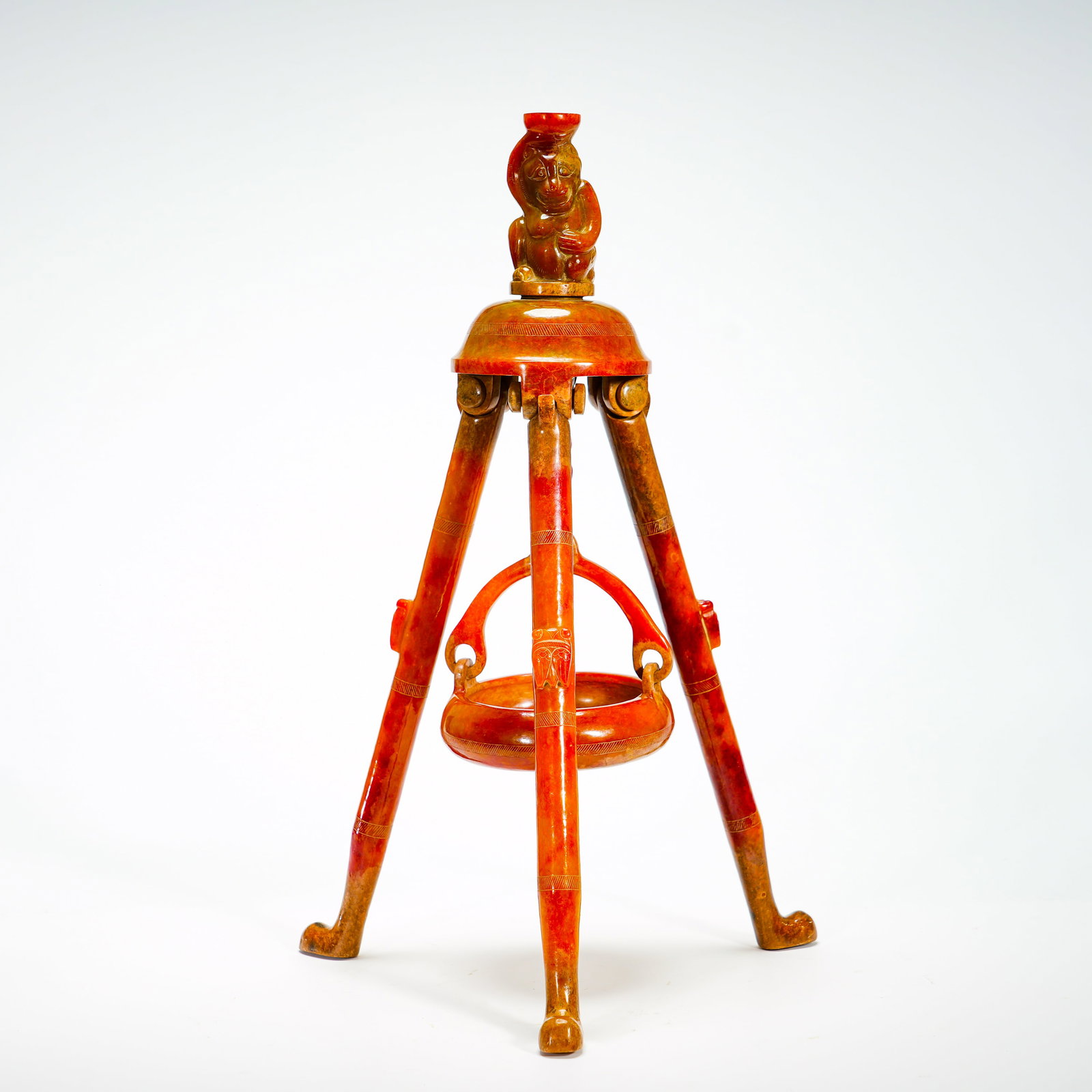 Zhan Hanyu's Monkey-Knob Three-Legged Frame Suspension Cauldron: Constructed from multiple jade components, the artifact adopts a tripod folding-leg structure with movable hinge joints. The dome-shaped top is crowned by a carved monkey finial. A ring-handled round 