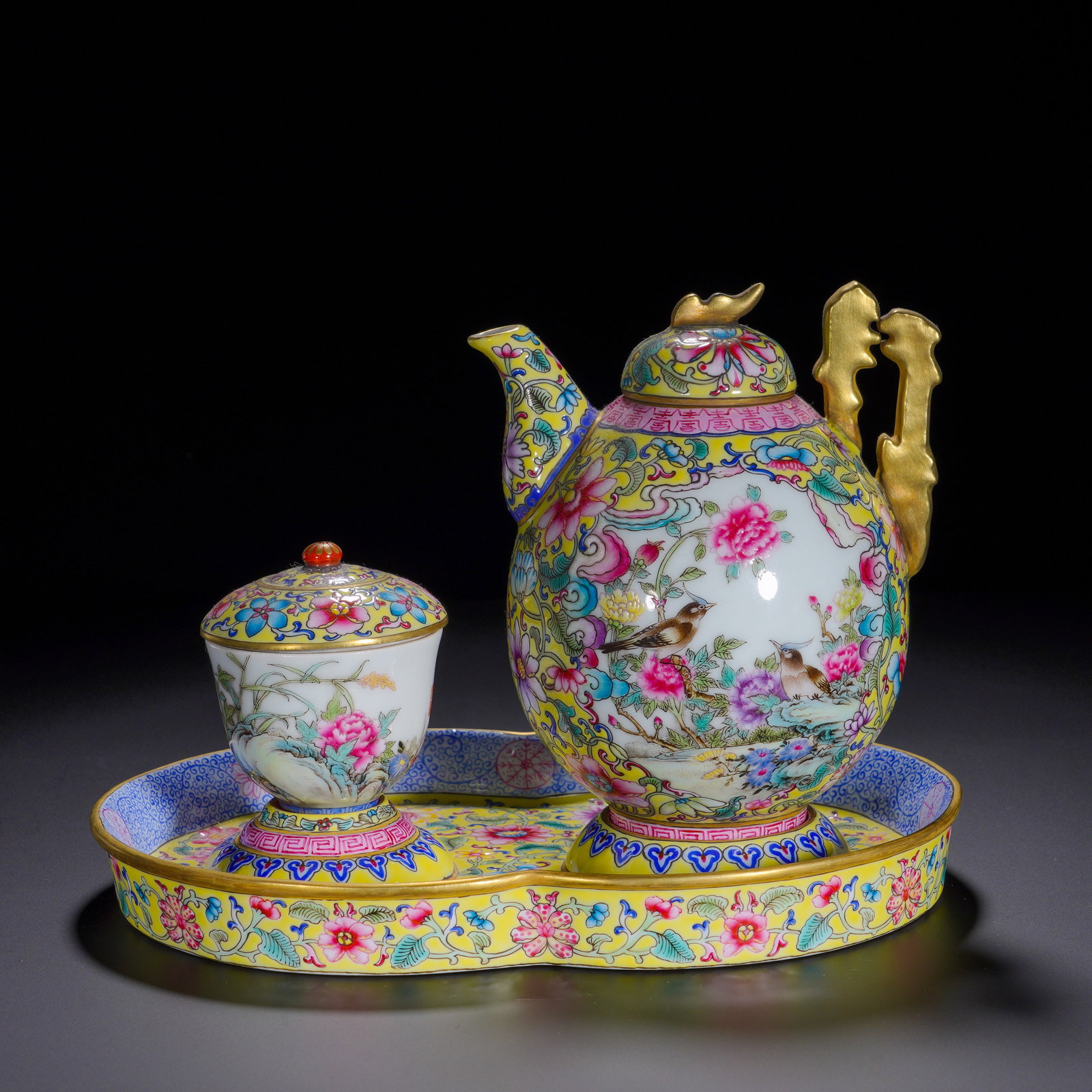 Qing Dynasty, Qianlong Pastel Entwined Flower Ewer Lid Cup: Complete imperial-grade tea set of Qianlong reign, including ewer, lidded cup and begonia-shaped tray. The ewer is painted overall with dense scrolling blossoms on bright yellow ground. Two reserved p