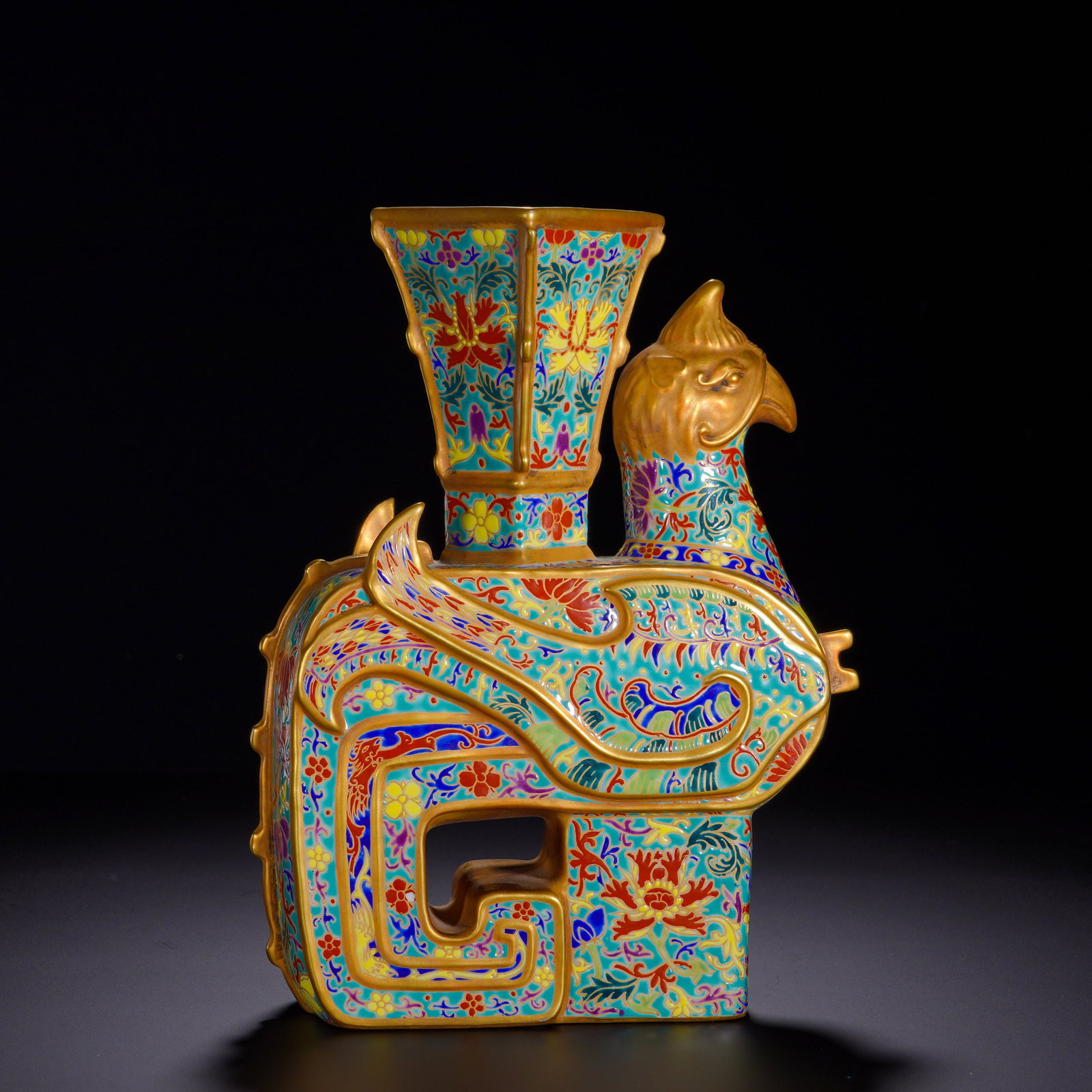 Qing Dynasty, Qianlong Porcelain Body Enamel Phoenix Vase: Important imperial display porcelain of Qianlong reign, modeled as a mythical phoenix bearing a ceremonial zun-vase upon its back. Phoenix head, wing edges and all rims are gilded to simulate gilt-bro