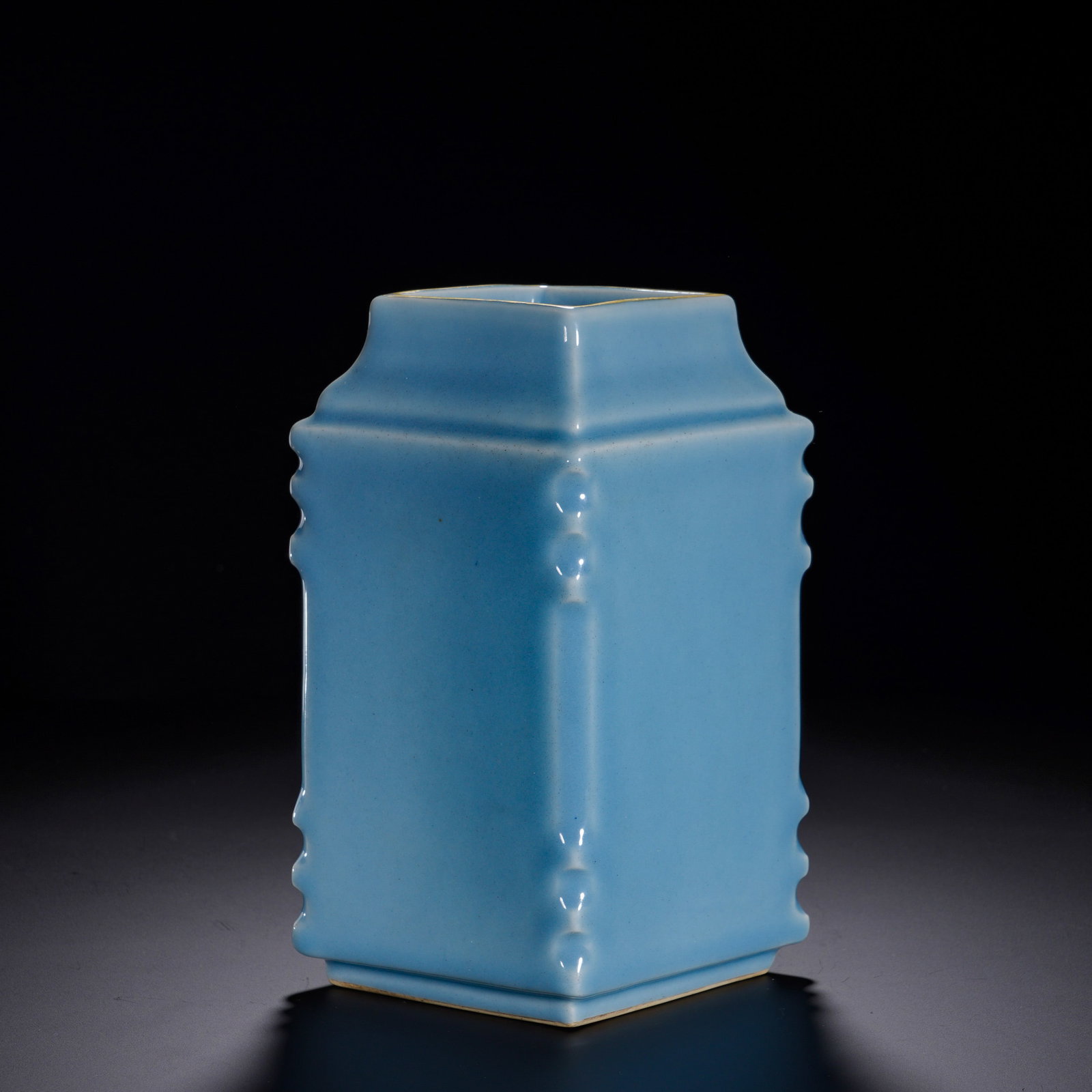 Qing Dynasty, Yongzheng Period, Sky Blue Glazed Four-Sided Vase with a Halberd: An imperial-quality monochrome-glazed porcelain for scholar??s display. Square-sectioned body with crisp angular contours, decorated with vertical raised flanges on each side. Rim and foot are slightl