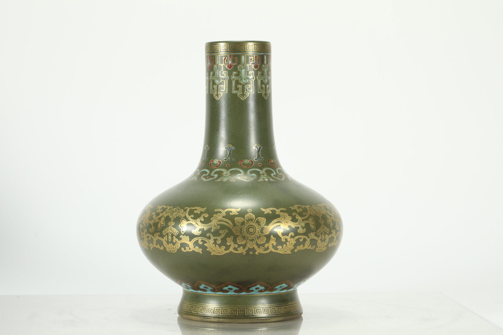 Qing Dynasty, Tea-Dust Glazed Gilt Vase: A Qing-dynasty tea-dust glazed gilt-decorated bivalve vase, Qianlong period imperial ware. It has a straight neck, flattened globular body, foot ring, with gilt rim and foot edge. The body is covered 