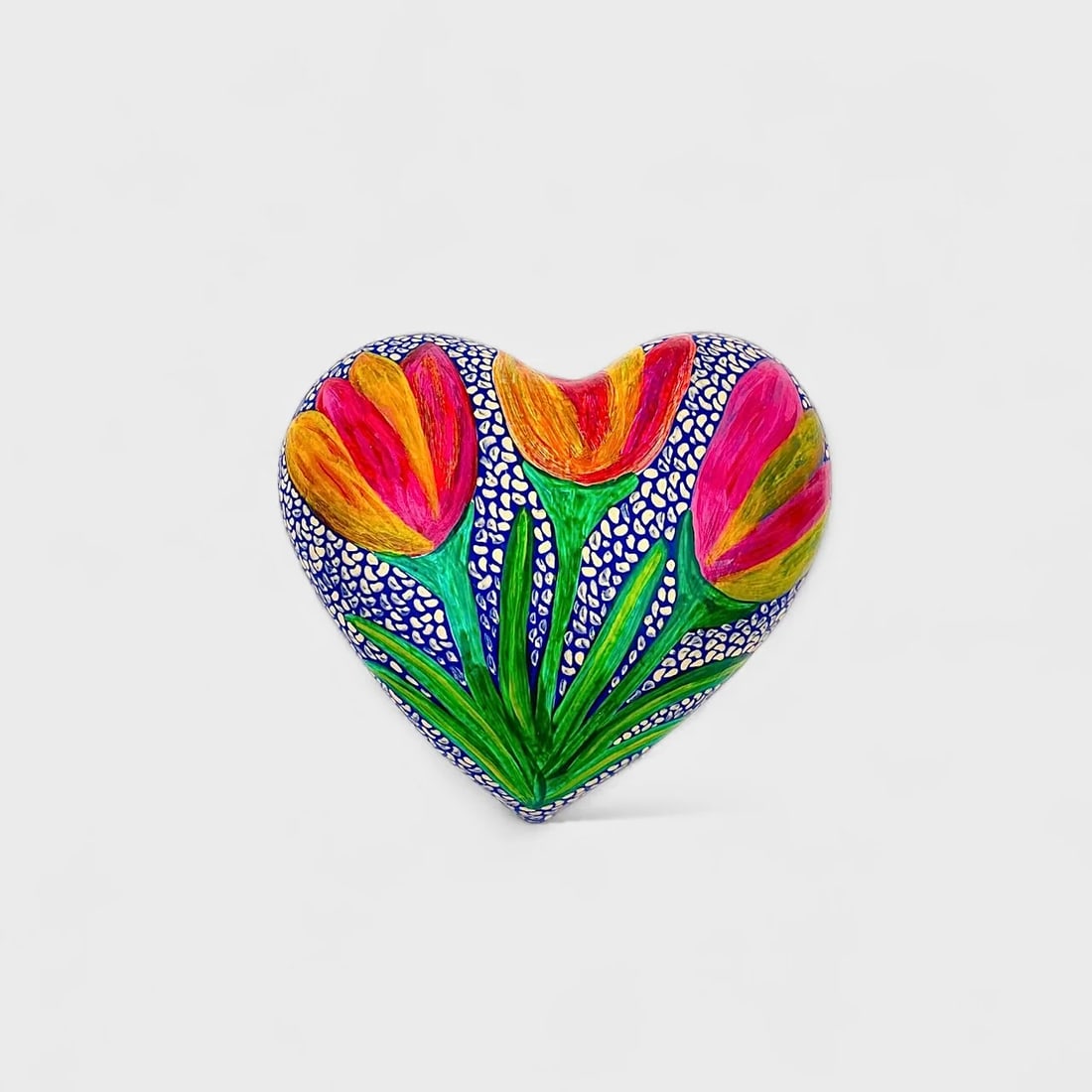 "Tulip Garden" Clay Heart: Albertina Lopez Ramirez Tulip Garden Heart2.4" (h) x 6.25" (l) x 5.5" (w)1.2 lbs. Hand-molded and hand-painted clay with floral detailing. Tulip Garden Heart by Albertina Lopez Ramirez brings