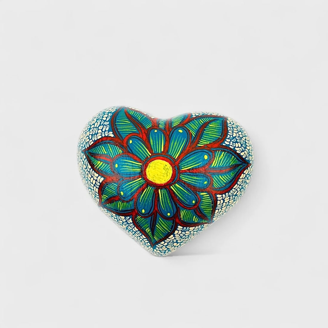 "Blue Blossom" Clay Heart: Albertina Lopez Ramirez Blue Blossom Heart 2.25" (h) x 5.5" (l) x 4.75" (w)1 lbs. Hand-molded and hand-painted clay with floral detailing. A celebration of bold symmetry and hand-painted rhythm, Blue