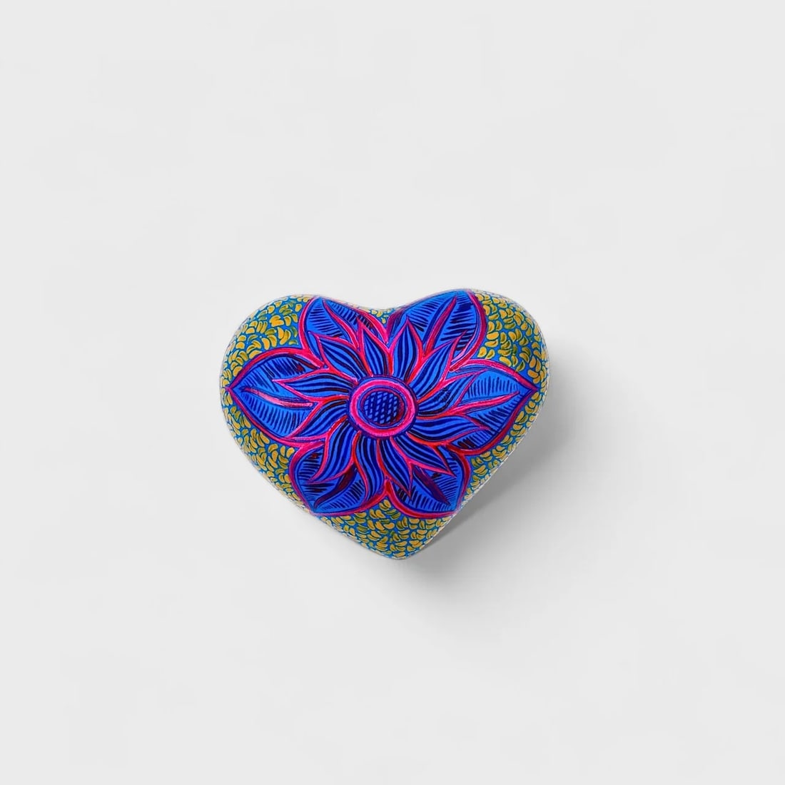 "Electric Bloom" Clay Heart: Albertina Lopez Ramirez Electric Bloom Heart 2.25" (h) x 5.5" (l) x 4.75" (w)1 lbs. Hand-molded and hand-painted clay with floral detailing. A radiant explosion of color and symmetry, Electric Bloom H