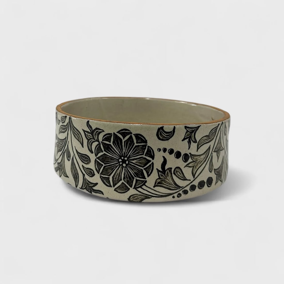 "Midnight Bloom" Hand-thrown and Painted Ceramic Bowl: Talavera de la ReynaMidnight Bloom Bowl3.5" (h) x 10" (l) x 10" (w)3.8 lbs. Hand-thrown and hand-painted ceramic. Black floral motif. Glaze finish. Delicate in execution and rich in tradition, the