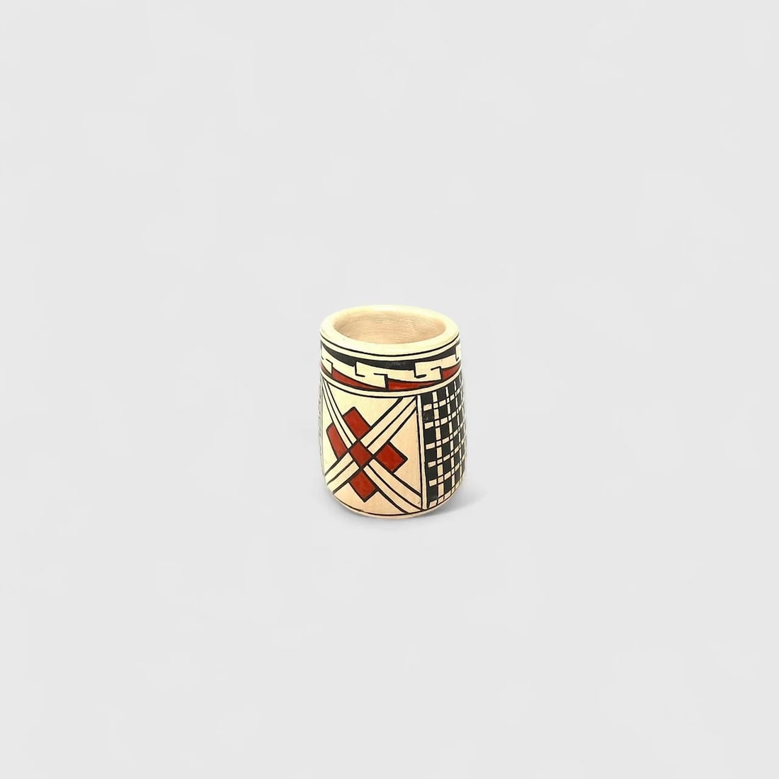 "Mata Ortiz Mezcalero" Handmade Clay Cup: Rebeca OrtizMata Ortiz Mezcalero2" (h) x 1.75" (w)0.1 lbs. Handmade clay cup using traditional coiling and finishing methods. Rooted in tradition and scaled for ritual, the Mata Ortiz Mezcalero by Reb