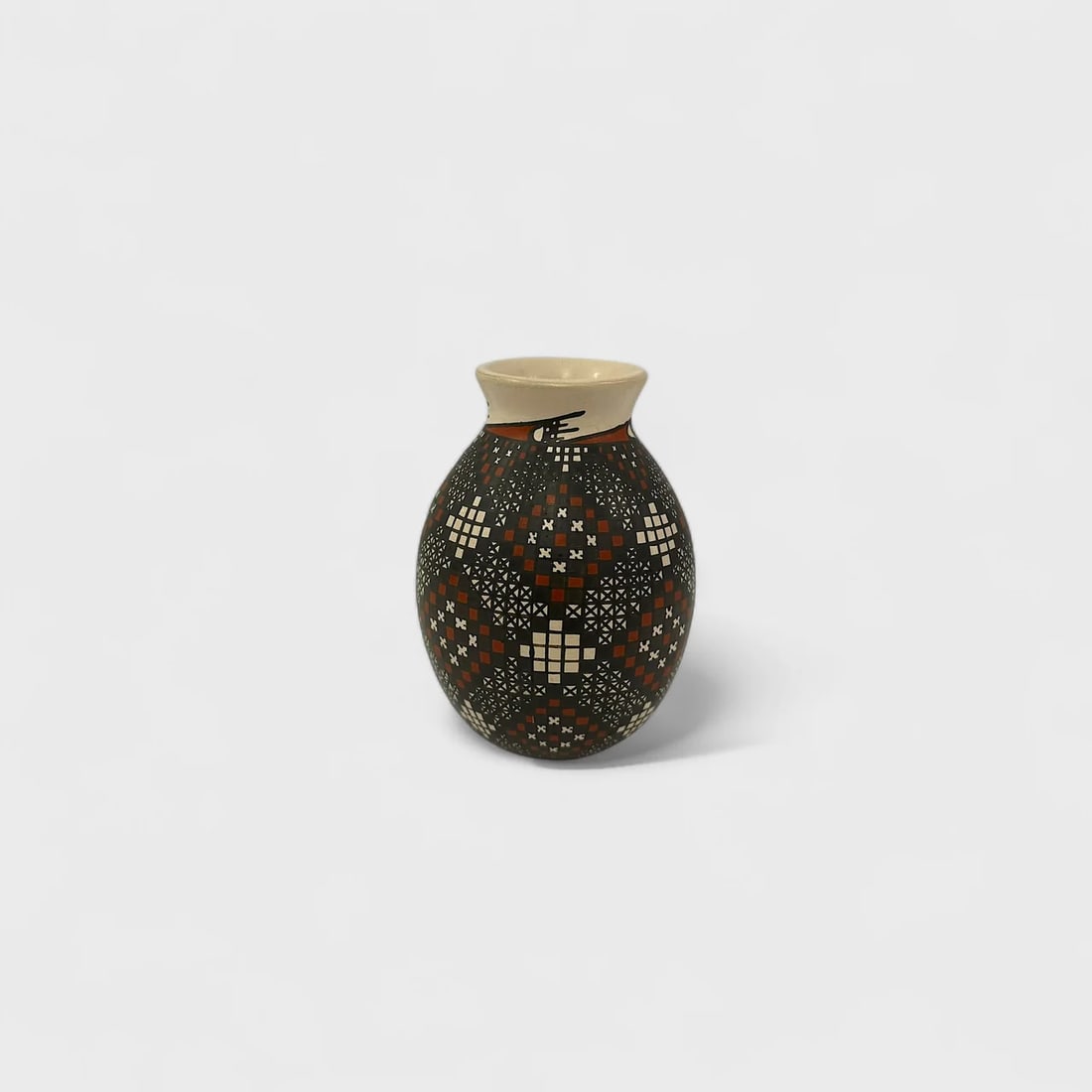 "Pixel Diamond Vase" Hand-coiled Clay Vase (1): Alma Flores Pixel Diamond Vase 13.5" (h) x 3" (w)0.76 lbs. Hand-coiled clay, painted with mineral pigments in geometric motifs using fine brushes and sgraffito detailing. Pixel Diamond Vase by Alma Fl