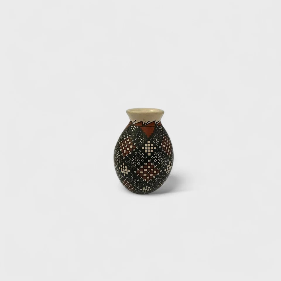 "Pixel Diamond Vase" Hand-coiled Clay Vase (4): Alma Flores Pixel Diamond Vase 43.5" (h) x 3" (w)0.76 lbs. Hand-coiled clay, painted with mineral pigments in geometric motifs using fine brushes and sgraffito detailing. Pixel Diamond Vase by Alma Fl