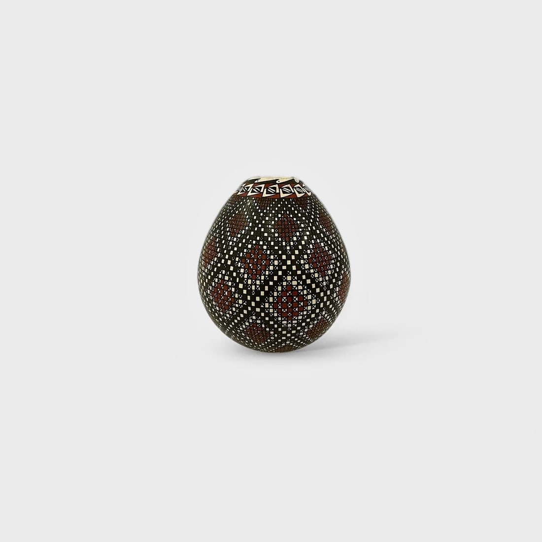 "Pixel Rythm Vase" Hand-coiled Clay Vase: Alma FloresPixel Rhythm Vase 5" (h) x 3.5" (w)1.33 lbs. Hand-coiled ceramic, micro-painted using fine brushes and mineral pigments. Signed. With a hypnotic sense of control and order, Pixel Rhythm Vas