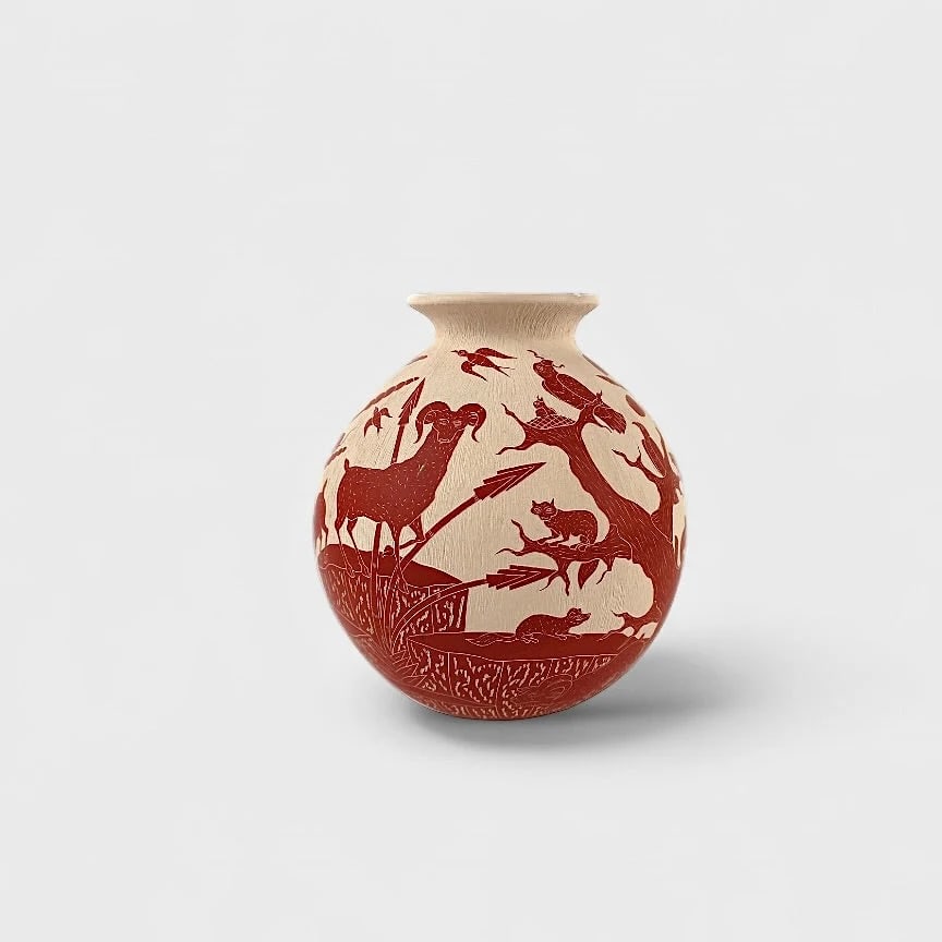 "Wild Harmony" Hand-coiled Clay Vase: Jesus Olivas Quintana Wild Harmony 7.5" (h) x 6.5" (w)1.8 lbs. Hand-coiled clay, sgraffito technique with terracotta-colored motifs. Signed. Wild Harmony by Jesús Olivas Quintana offers a peaceful po