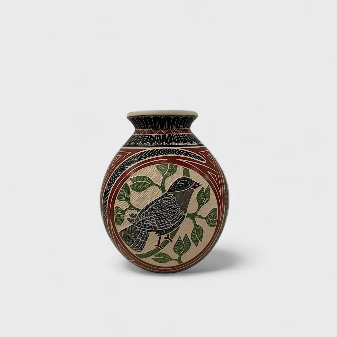 "Blue Bird in the Canopy" Hand-coiled Ceramic Vase: Hilario Quezada Blue Bird in the Canopy8" (h) x 7" (w)Weight not Specified. Hand-coiled ceramic with etched designs and geometric red and black accents. Signed. Blue Bird in the Canopy by Hilario Quez