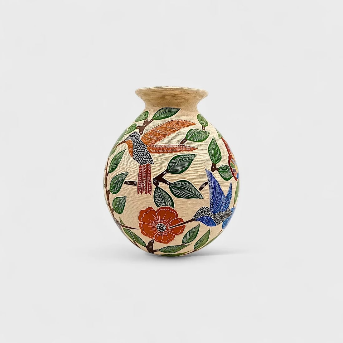 "Garden Whispers" Hand-coiled Ceramic Vase: Sandra Lorena Arras OlivasGarden Whispers Vase 8" (h) x 6.5" (l)1.5 lbs. Hand-coiled ceramic with hand-painted motifs and designs using traditional Mata Ortiz technique. Signed.Alive with motion and i