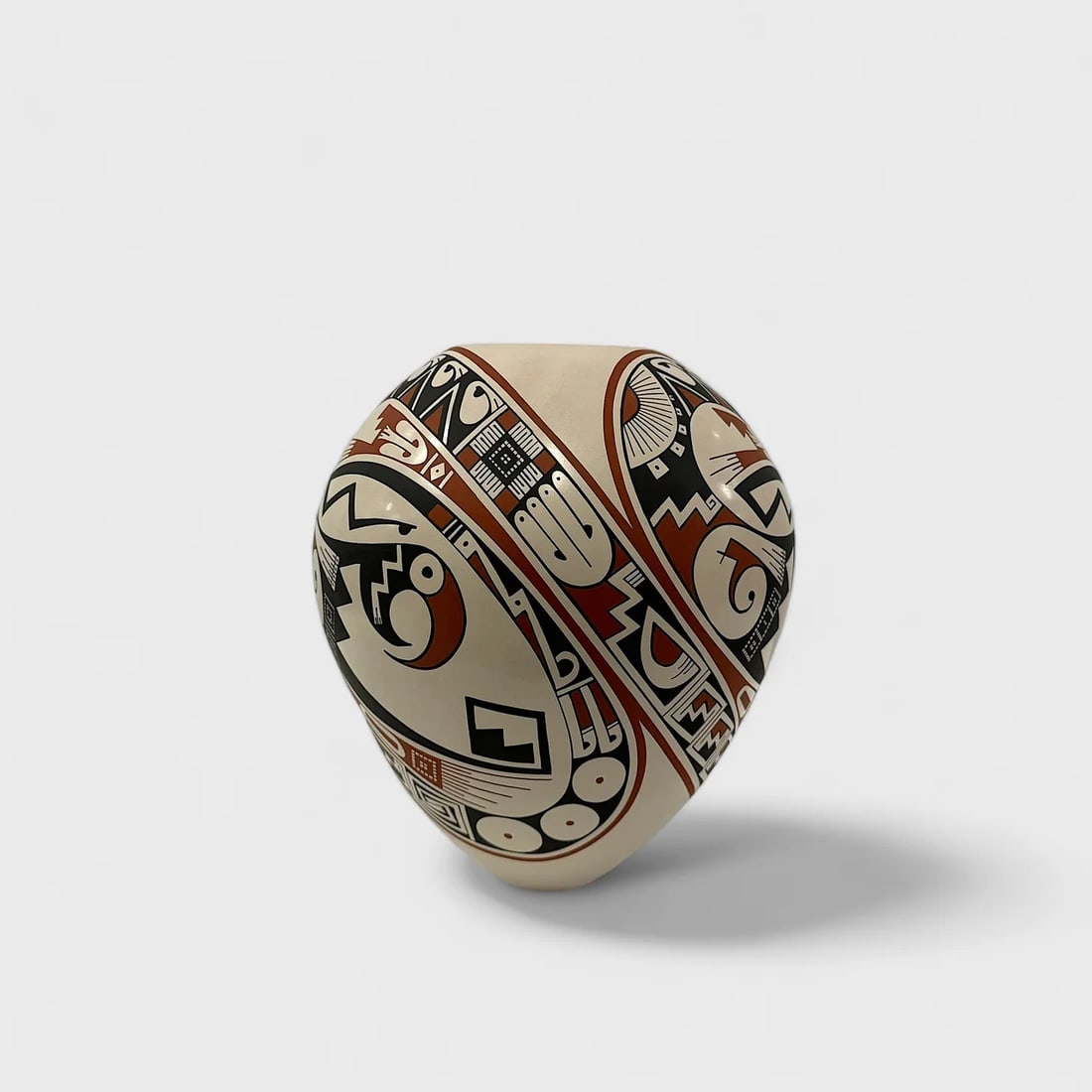 "Parrots Symbols" Hand-coiled Clay Vase: Rodrigo Perez Parrots Symbols Vessel10.5" (h) x 7.5" (w)2.6 lbs. Hand-coiled clay, hand-painted in black and red over beige, symbolic motifs. Signed. Symbolic and precise, Parrot Symbols Vessel by Rod