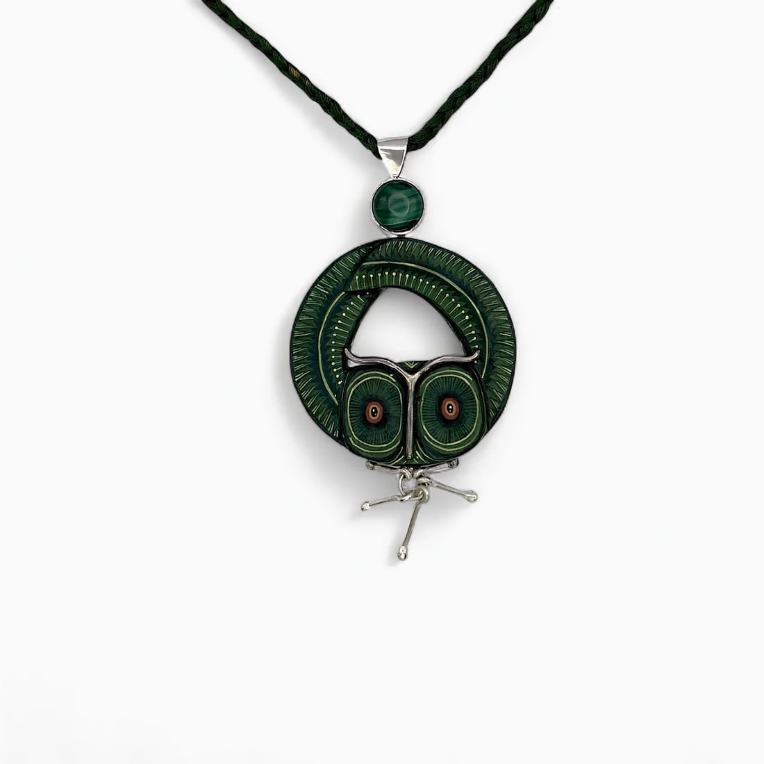 "Night Watcher I" Zapotec Necklace: Striking in form and meaning, Night Watcher embodies the mysticism of Zapotec symbolism through the form of a watchful owl. Expertly hand-carved from copal wood and set within a sterling silver frame,