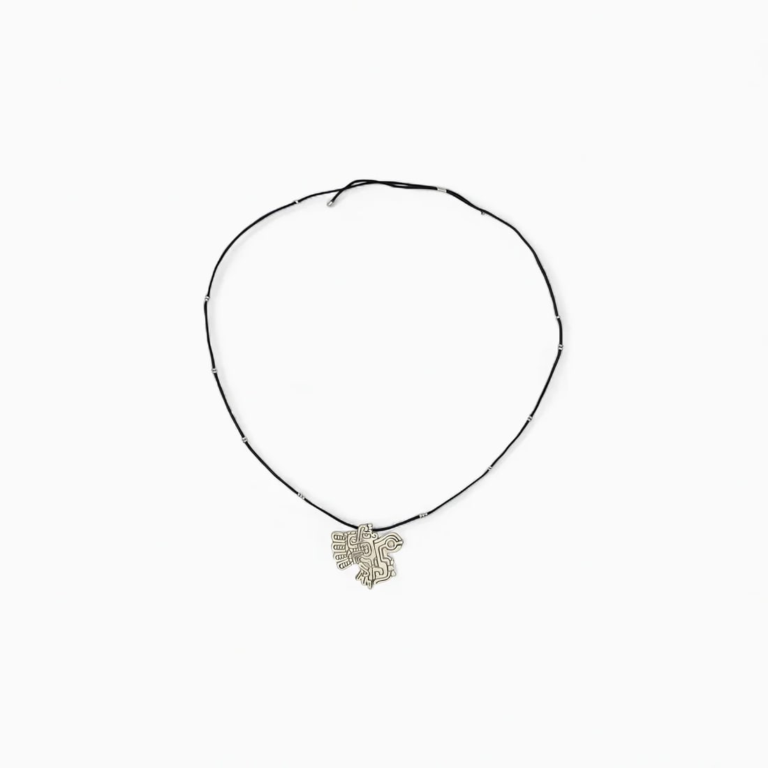 "Spirit of the Chavín Sky" Necklace: Minimal yet rich in symbolism, Spirit of the Chavín Sky features a stylized winged deity rendered in clean silver lines—a refined interpretation of ancient Chavín iconography. With its openwork de