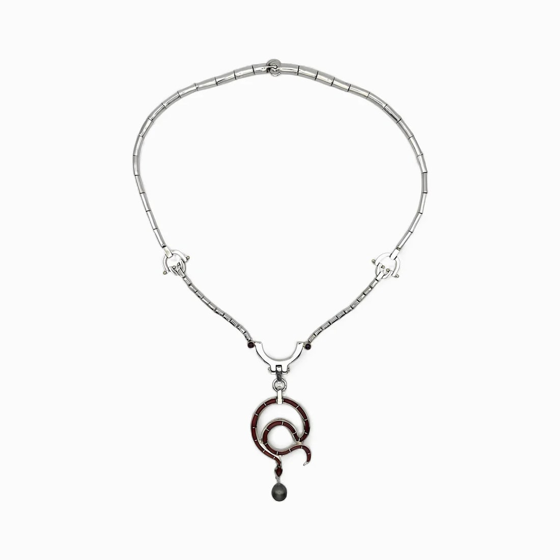"Reptile" 14K Gold, Carnelian Stone, Ruby, and Tahitian Black Pearl Necklace: Merging sculptural strength with sinuous grace, Reptile Necklace by Carmen Tapiaexemplifies the refined artistry of contemporary Taxco silverwork. Crafted in 0.925sterling silver with 14k gold accents