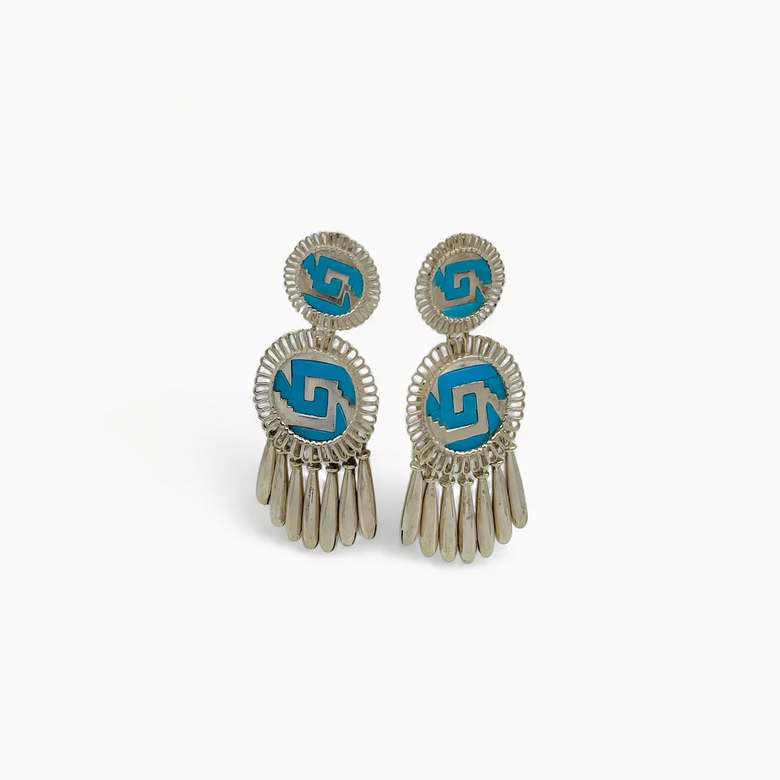 "Echo Shields" Turquoise Earrings: The Echo Shields Earrings by Oro de Monte Albán transform ancestral symbolism into a statement of motion and sound. Each earring features two hand-inlaid turquoise medallions with the signature chima