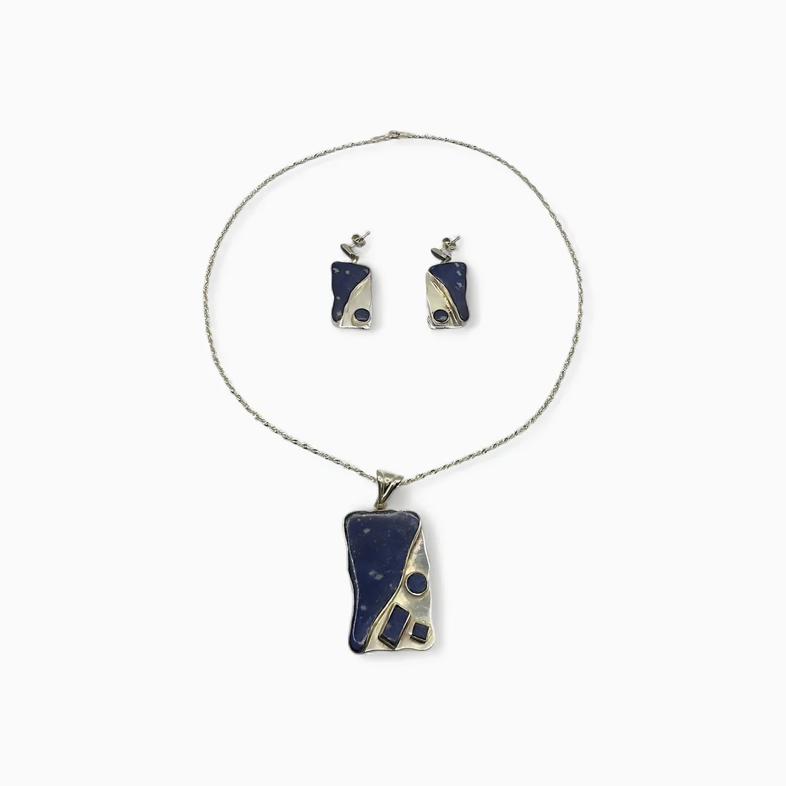 "Midnight Geometry" Chilean Lapis Lazuli Necklace & Earring Jewelry Set: With a bold yet balanced interplay of angles and color, the Midnight Geometry Set by Chilean artisan Victor Hugo pairs architectural design with the natural depth of lapis lazuli. The pendant and earr