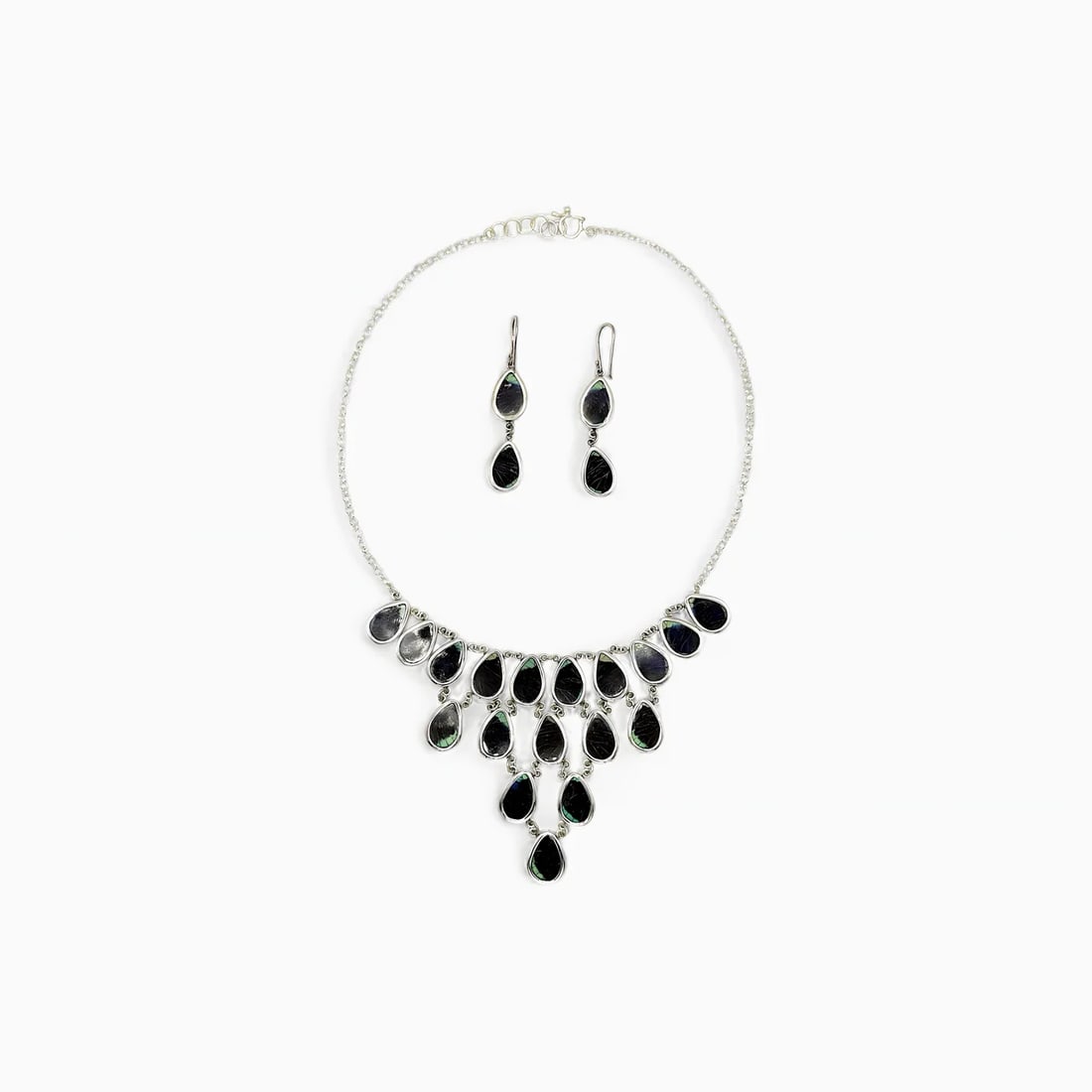"Midnight Spiral" Necklace & Earring Jewelry Set: The Midnight Spiral Necklace Set is a bold expression of natural symmetry and dark-toned elegance. Crafted with real butterfly wings in deep shades of black and green, this tiered necklace and earring