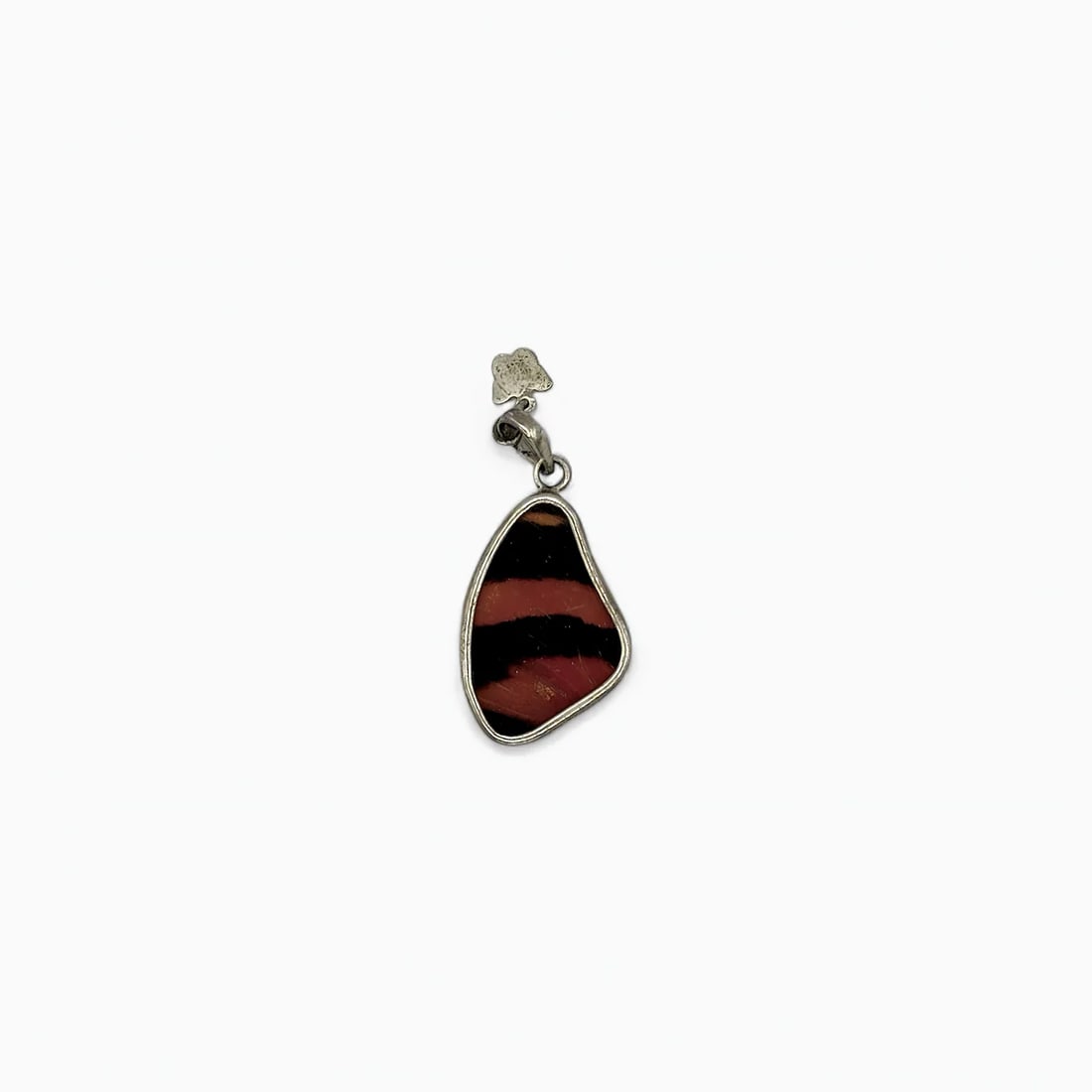"Bold Stripe" Small Butterfly Wing Jewelry Pendant: This striking medium-sized pendant by Yolanda Ormachea captures the vibrancy of nature through its vivid double-sided design. One side displays rich rust-red and black stripes with a velvety sheen, wh