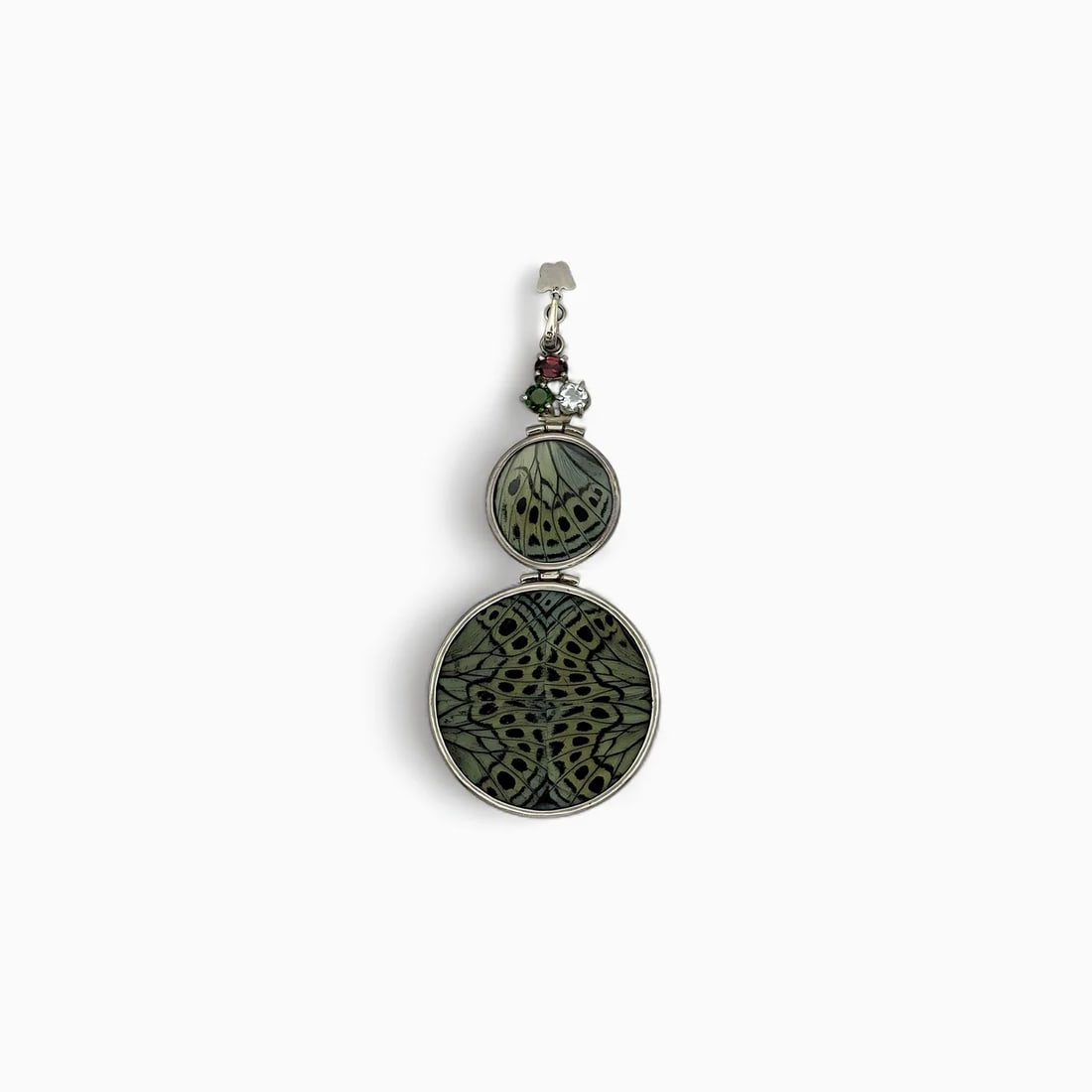 "Forest Eclipse" Double Circle Butterfly Wing Jewelry Pendant: The Forest Eclipse Pendant combines organic pattern and bold contrast in a powerful, symmetrical form. Handcrafted from ethically sourced real butterfly wings, the pendant’s front side displays a vi
