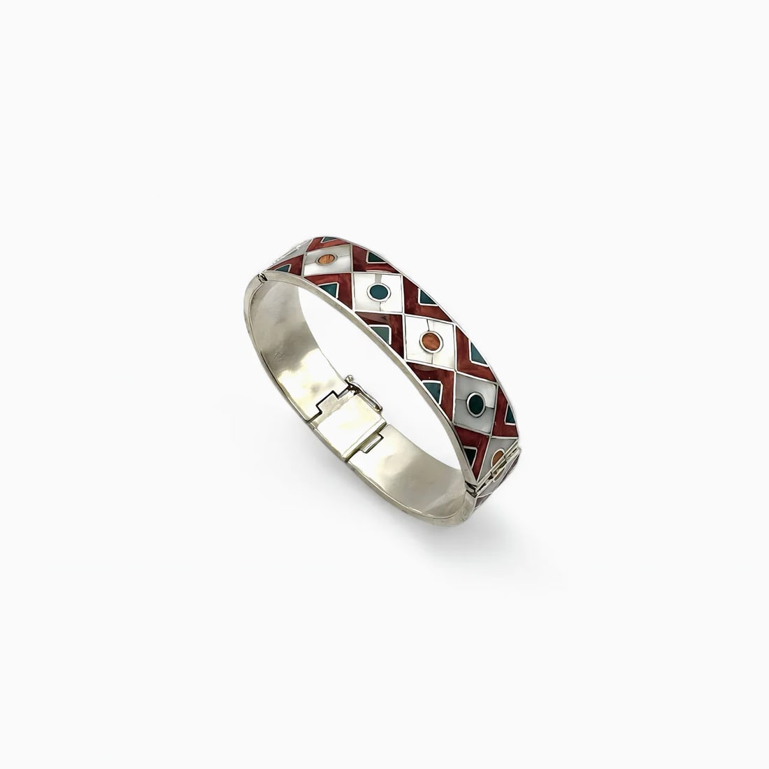 "Mito’s Diamond Design" Silver Bracelet: The Mito’s Diamond Design Bracelet is a clean yet striking statement piece featuring bold symmetry and rich colorwork. Handcrafted in sterling silver, the bracelet’s surface showcases a geometric 
