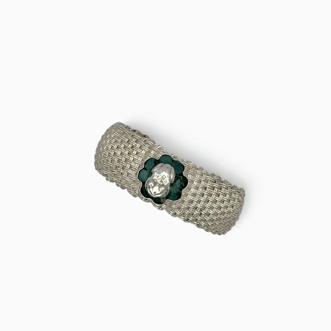 "Woven Frog" Chrysocolla Stone Bracelet: This unique handcrafted bracelet by the renowned Peruvian design collective CIEC–Sipán combines traditional weaving techniques with symbolic iconography rooted in ancient Andean culture. The focal 