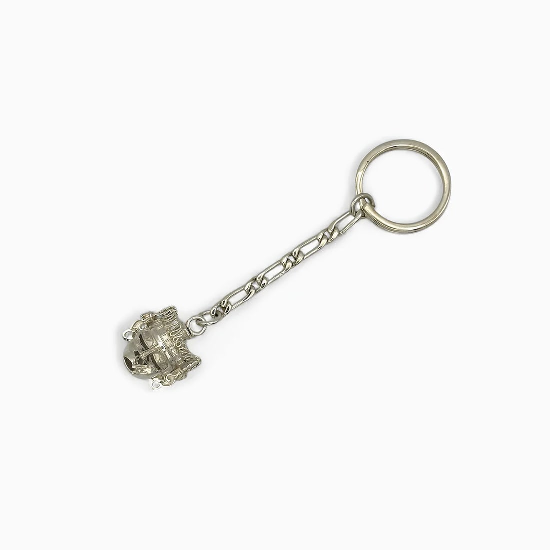 "Big Face I" Columbian Mask Keychain: Both sculptural and symbolic, the Big Face Keychain by Oro de Monte Albán brings ancient character into your daily routine. Handcrafted in sterling silver, the bold face design draws from pre-Columbi