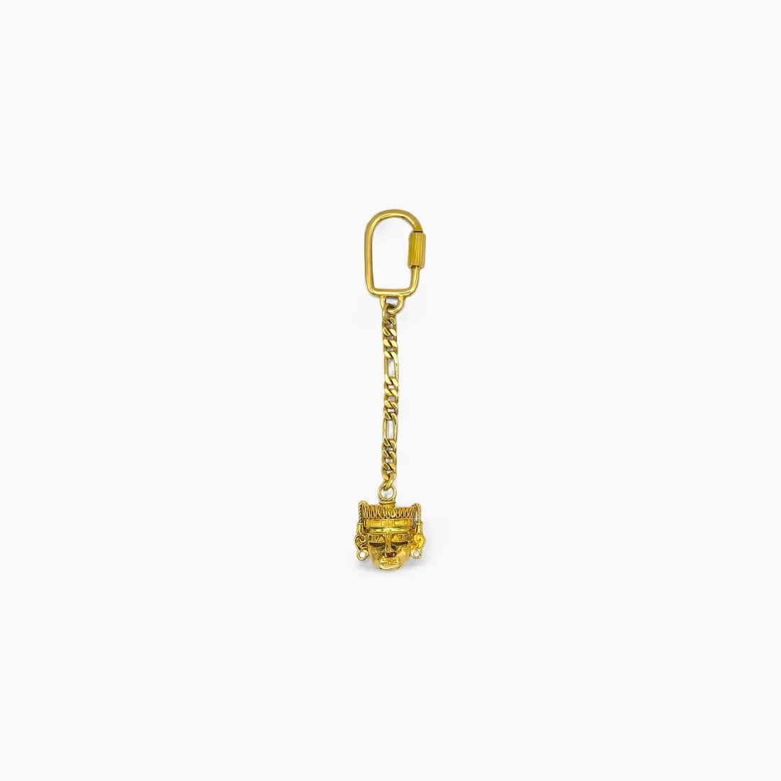 "Big Face Dual-Tone" 14K Gold Keychain: A bold tribute to ancient Mesoamerican artistry, the Big Face Dual-Tone Keychain from Oro de Monte Albán transforms everyday utility into a statement of heritage. Suspended from a textured chain, the