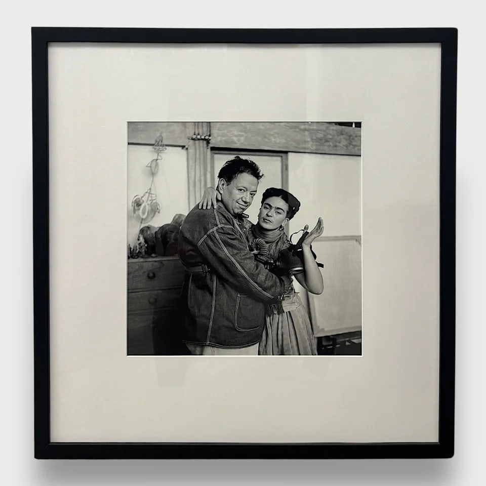 "Frida and Diego with Gas Mask" Framed Photograph: Nickolas Murray"Frida and Diego with Gas Mask"Frame: 21" x 21.5" / Image: 11.875" x 11.875" Photograph / Gelatin Silver Print Striking and surreal, Frida and Diego with Gas Mask is a limited edition g