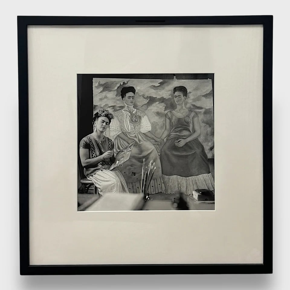 "Two Fridas" - Framed Photograph: Nickolas Muray "Two Fridas"Frame: 21" x 21.5" / Image: 12.25" x 12.25"Photograph / Gelatin Silver Print Iconic and deeply intimate, Two Fridas is a 1939 gelatin silver print by Nickolas Muray,