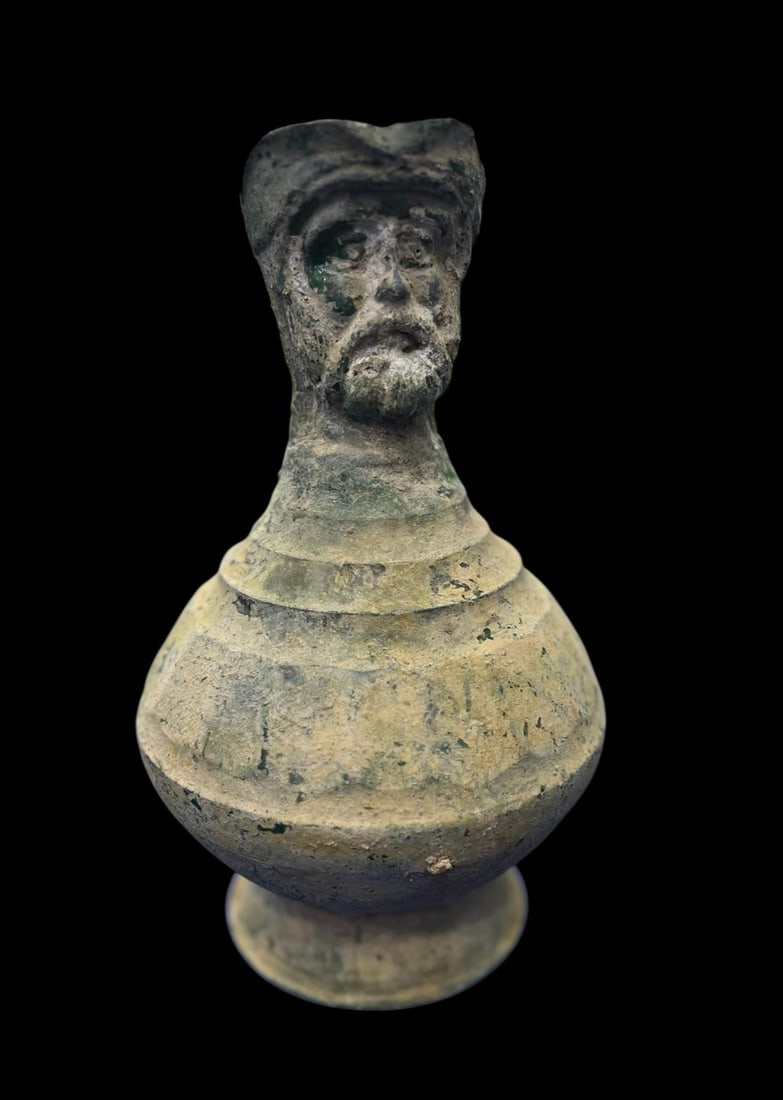 Ancient antique Roman glass jug: Ancient antique Roman glass jug, beautifully preserved with an elegant form and natural iridescence developed over centuries. A rare collectible artifact that reflects the artistry and craftsmanship o