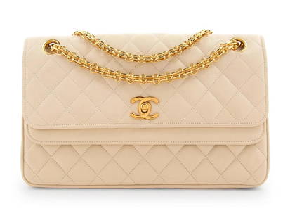 Chanel Cream Quilted Double Flap Bag: Chanel Cream Quilted Double Flap Bag with Mademoiselle Chain, Circa 1980's. Cream quilted leather double flap bag with gold-tone chain strap and 22 karat gold plated twist lock. Label Chanel.