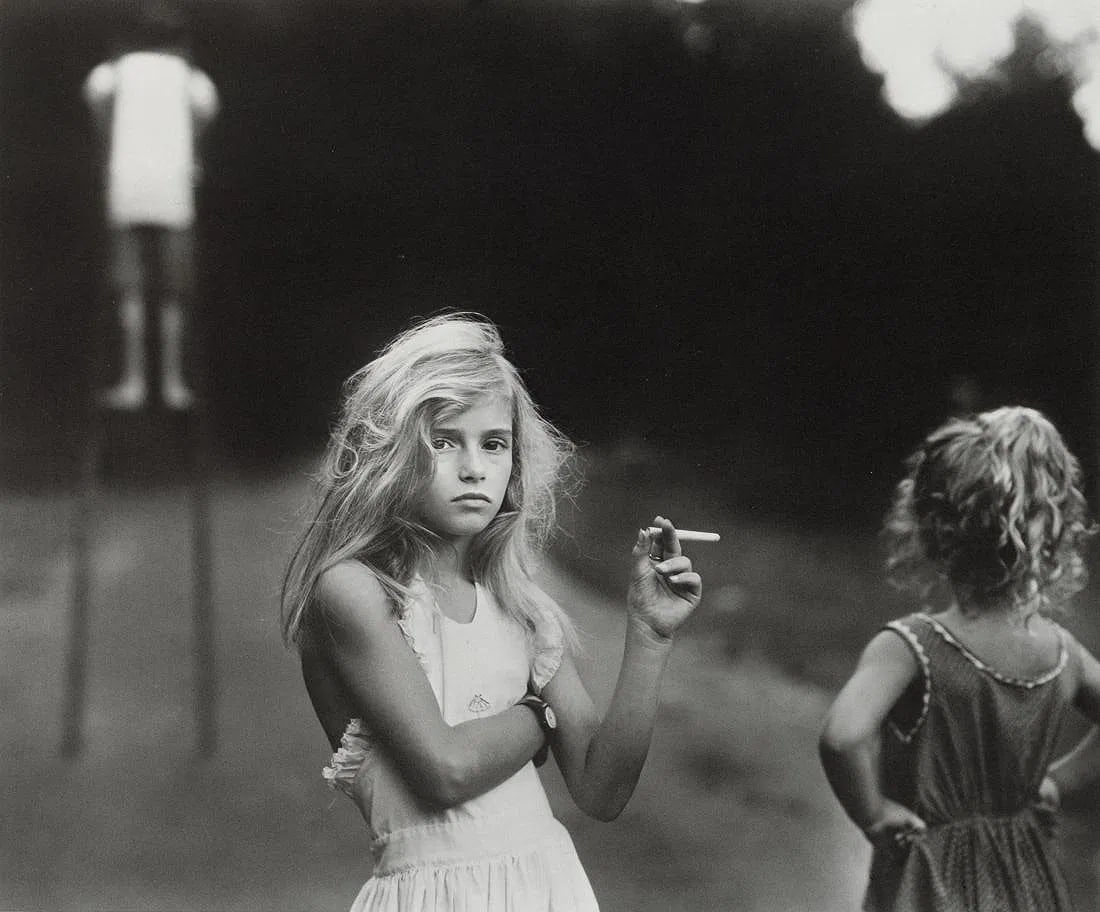 Sally Mann - Candy Cigarette, 1989: Sally Mann - Candy Cigarette, 1989. Medium: Photo Litho. Measures: 7 1/2 x 6 inches, mounted to foamboard.