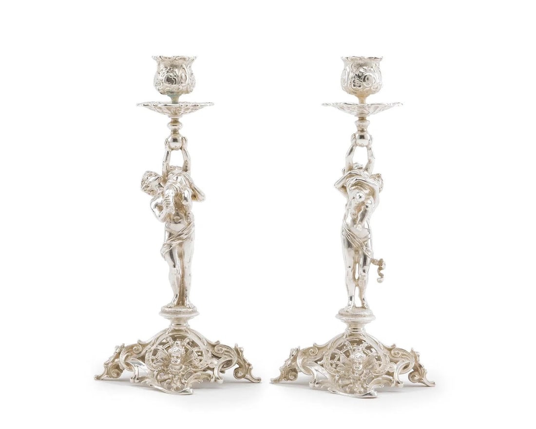 Pair of German Bruckmann & Söhne 800 Silver Figural: Pair of German Bruckmann & Söhne 800 Silver Figural Candlesticks. They measure H: 8 1/2" W: 4 1/2" D: 2 3/4". 22.450 oz. troy approximately