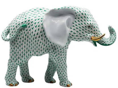 Herend Hungary Porcelain Elephant Figurine: Large porcelain sculpture of a majestic elephant decorated with green fishnet design. With large ears and upturned trunk, he