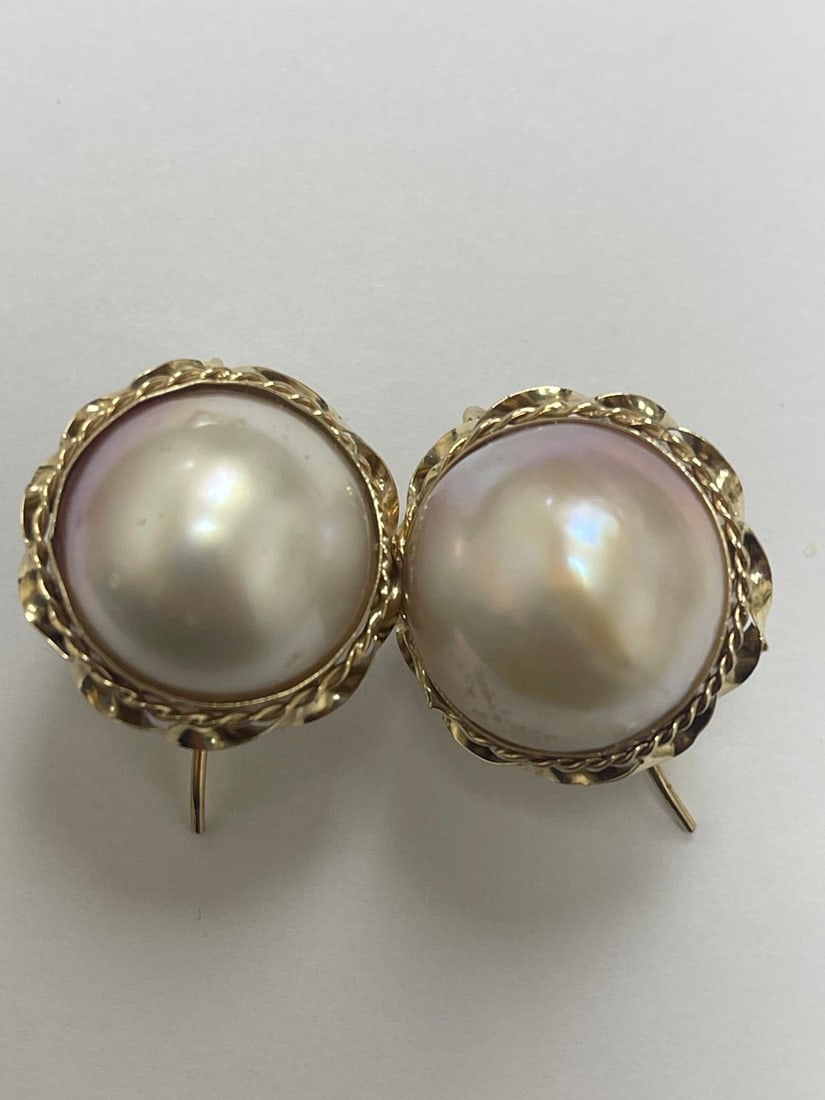 14K Gold Moby Pearl Earrings With French Backs: Features large, luminous Moby pearls with exceptional luster and natural beauty. Set in solid 14K gold frames with elegant twisted wire detailing. Secured with classic French backs, also crafted in 14