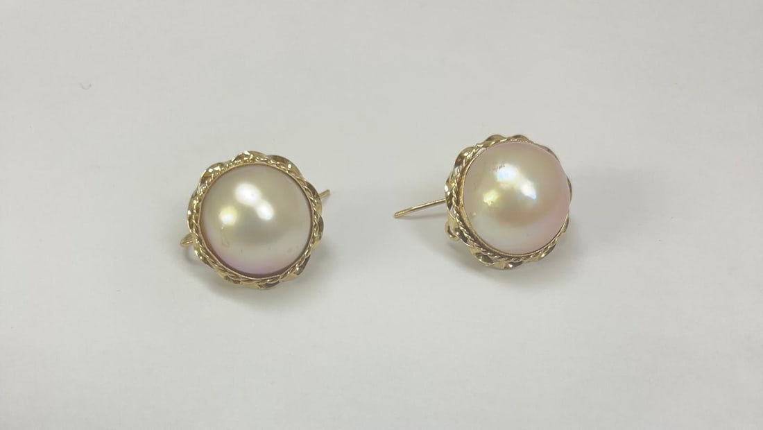 14K Gold Moby Pearl Earrings With French Backs: Features large, luminous Moby pearls with exceptional luster and natural beauty. Set in solid 14K gold frames with elegant twisted wire detailing. Secured with classic French backs, also crafted in 14